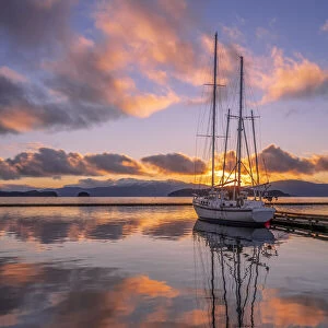 Sailboat in Auke Bay at sunset, Alaska, USA