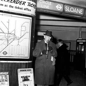 Busker George Russell playing his Recorder outside Sloane Square Tube Station